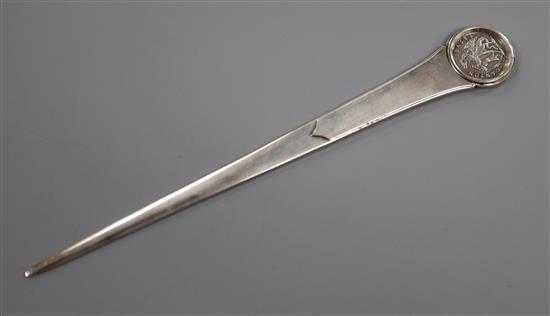 A Swiss Tezler 800 white metal letter opener with inset coin terminal, 24cm.